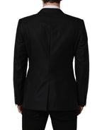 Dark blue wool men's blazer jacket by Dolce & Gabbana, single-breasted design, tailored fit with notch lapel and button closure.