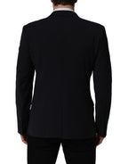 Dark blue wool men's blazer jacket by Dolce & Gabbana, single-breasted design with notch lapels and tailored fit.