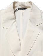 Dolce & Gabbana off-white flax single-breasted blazer jacket with notch lapels and tailored fit, displayed on a hanger.
