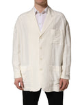 Dolce & Gabbana off-white flax single-breasted blazer jacket displayed on a hanger, showcasing tailored fit and classic lapel design.