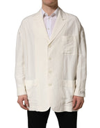 Dolce & Gabbana off-white flax single-breasted blazer jacket displayed on a hanger, showcasing tailored fit and classic lapel design.