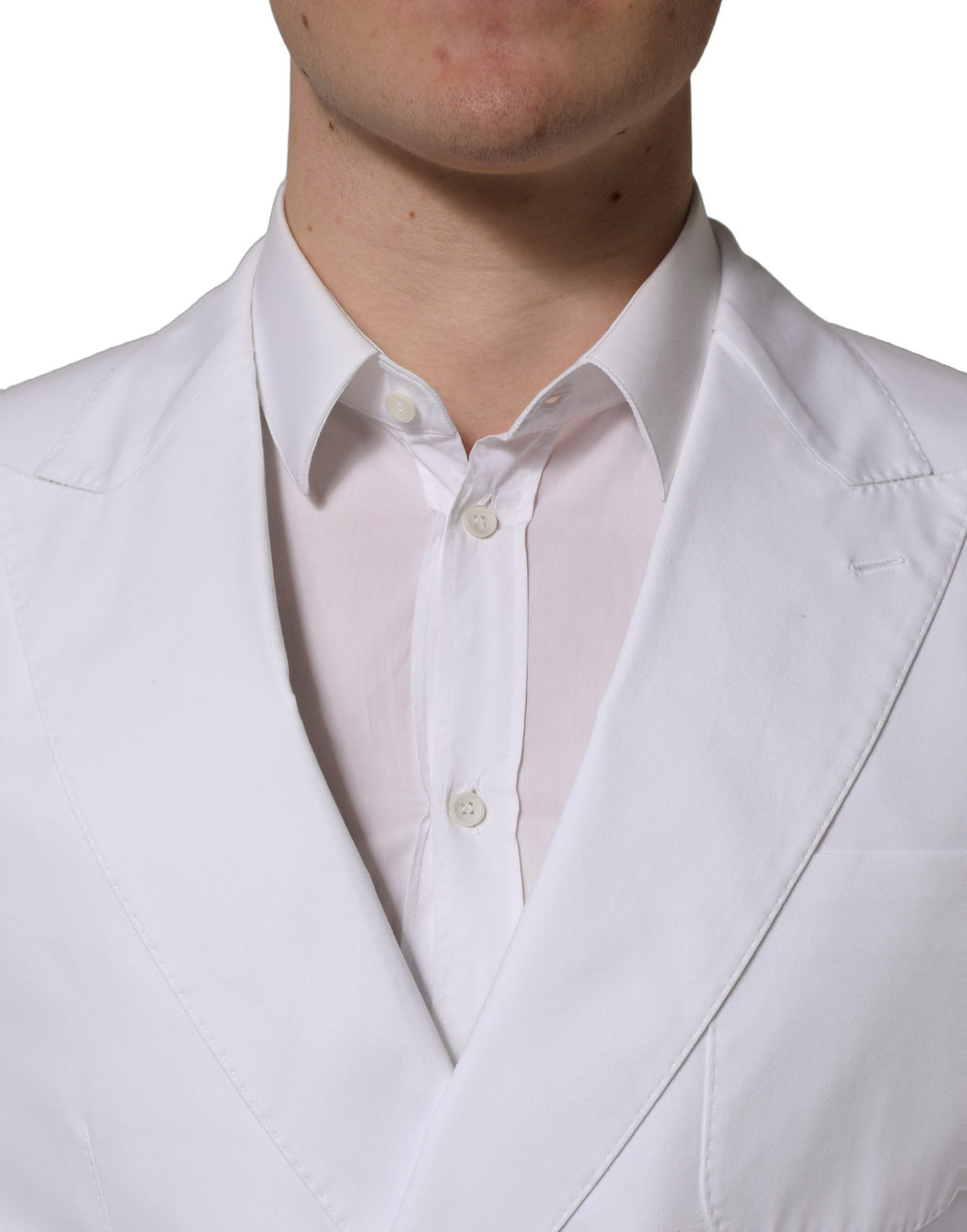 Dolce & Gabbana white cotton double-breasted blazer jacket with classic lapel and tailored fit, shown on a hanger.