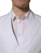 Dolce & Gabbana white cotton double-breasted blazer jacket with classic lapel and tailored fit, shown on a hanger.