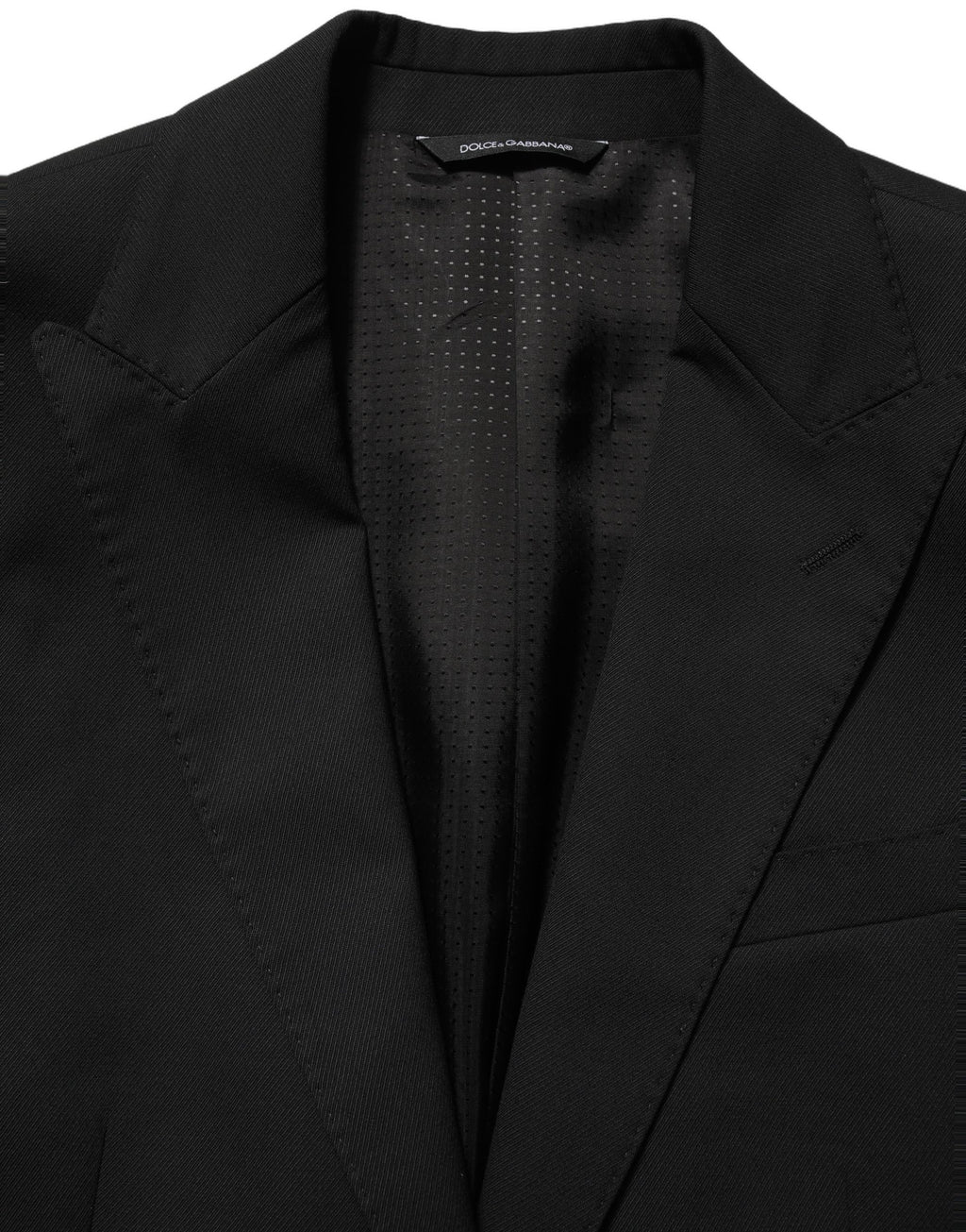 Dolce & Gabbana black polyester single-breasted blazer jacket displayed on a hanger with a tailored fit and classic lapel.