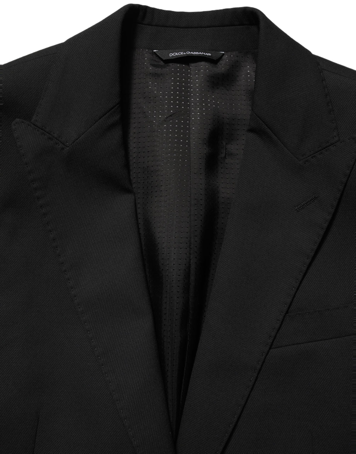Dolce & Gabbana black polyester single-breasted blazer jacket displayed on a hanger with a tailored fit and classic lapel.