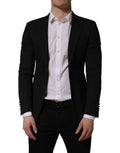 Black polyester Dolce & Gabbana single-breasted blazer jacket with notch lapels and tailored fit, shown on a hanger.