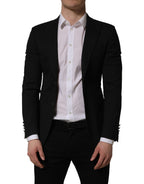 Black polyester Dolce & Gabbana single-breasted blazer jacket with notch lapels and tailored fit, shown on a hanger.