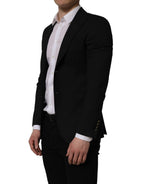 Dolce & Gabbana black polyester blazer jacket with single-breasted design and notch lapels, tailored for a sleek fit.