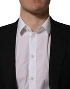 Dolce & Gabbana black polyester blazer jacket with single-breasted design and notched lapels, displayed on a hanger.