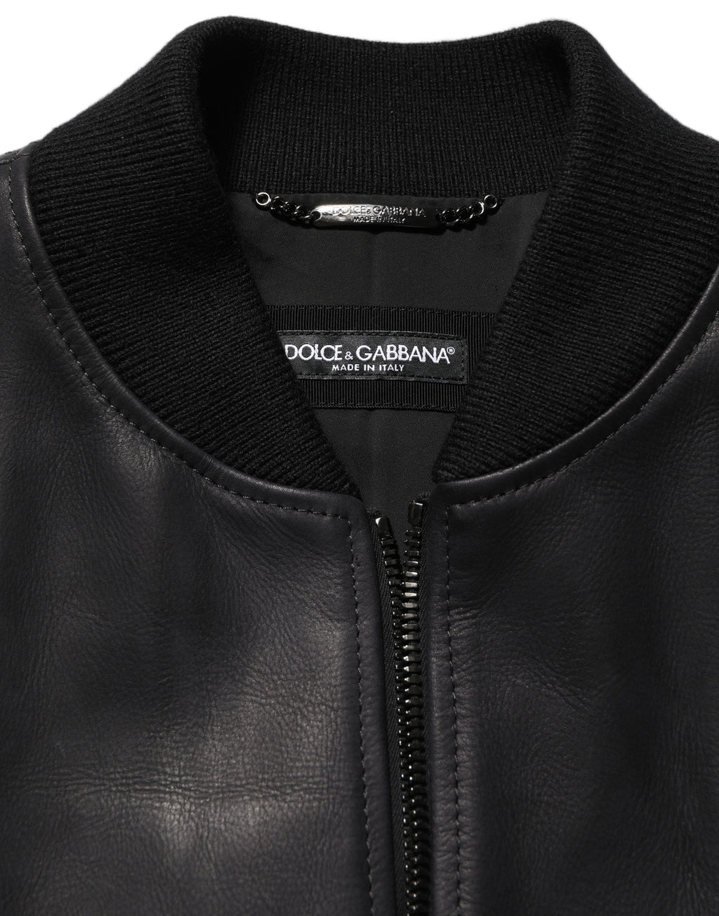 Black leather full-zip biker jacket for men by Dolce & Gabbana, featuring a stylish and fitted design with zip details and a high collar.
