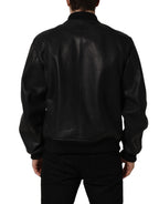 Black leather Dolce & Gabbana men's biker jacket with full zip and stylish design, displayed on a hanger.