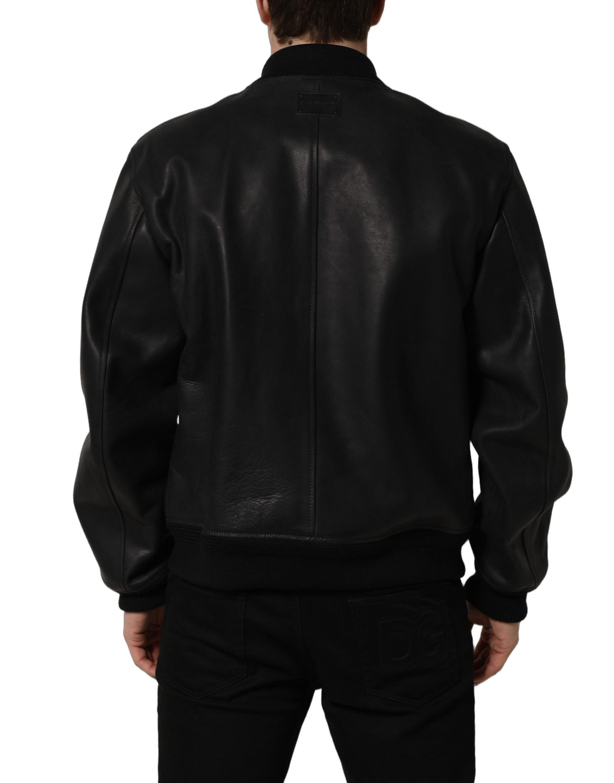 Black leather Dolce & Gabbana men's biker jacket with full zip and stylish design, displayed on a hanger.