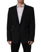 Black wool Dolce & Gabbana single-breasted blazer jacket with notch lapels and tailored fit, displayed on a mannequin.