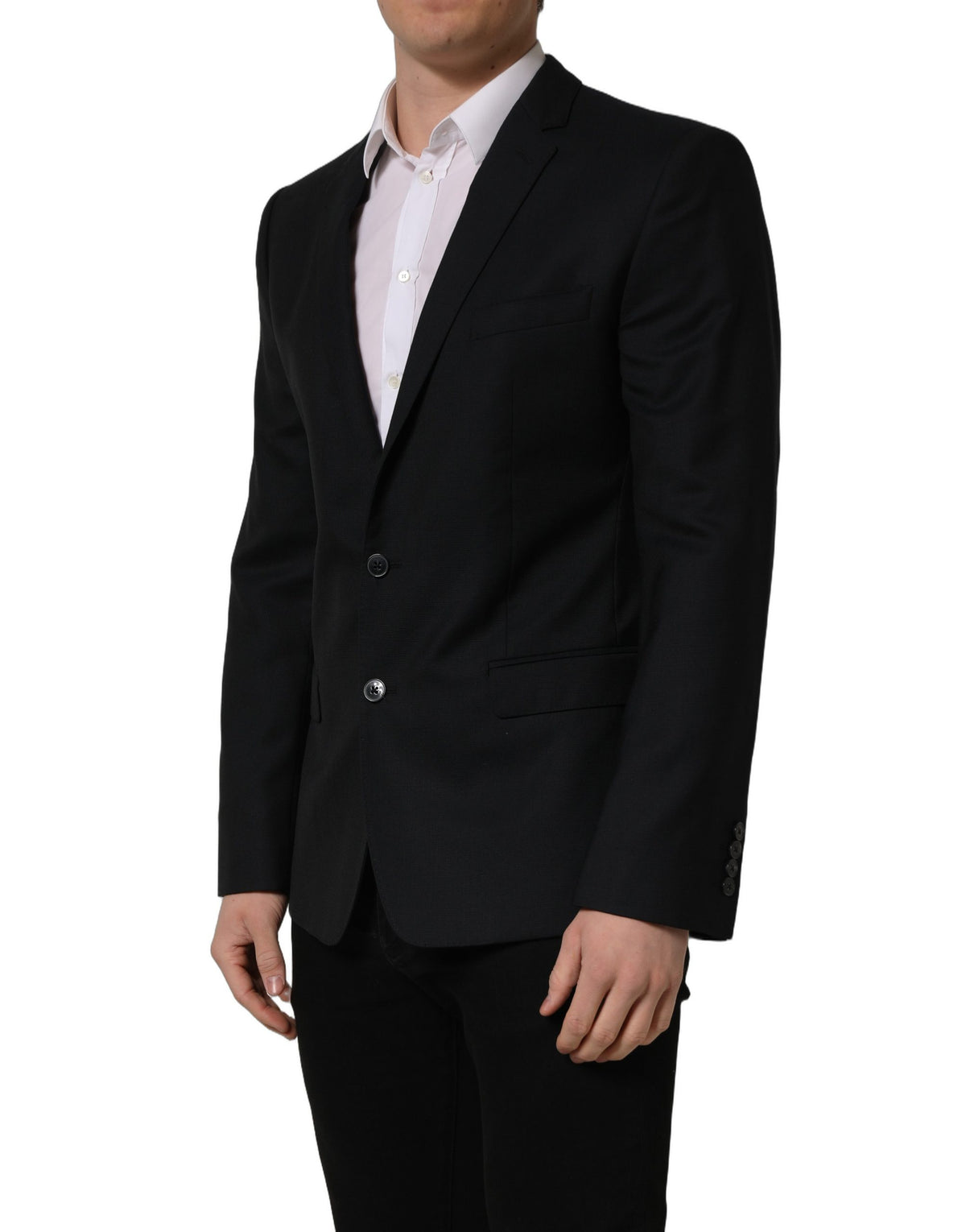 Dark blue wool Dolce & Gabbana single-breasted blazer jacket with notch lapels and button closure, tailored fit, on a hanger.