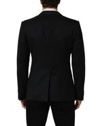 Dark blue Dolce & Gabbana wool single-breasted blazer jacket with notch lapels and tailored fit, displayed on a neutral background.