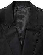 Dolce & Gabbana black wool blazer jacket with single-breasted design and classic lapel, tailored fit, front button closure.
