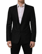 Black wool Dolce & Gabbana single-breasted blazer jacket with notch lapel and tailored fit, displayed on a hanger.