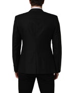 Dolce & Gabbana black wool single-breasted blazer jacket displayed on a hanger, showcasing classic tailored design.