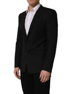 Dolce & Gabbana black wool single-breasted blazer jacket displayed on a hanger with a tailored fit and classic lapel design.