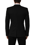 Dolce & Gabbana black wool single-breasted blazer jacket displayed on a hanger, showing its tailored fit and classic lapel design.