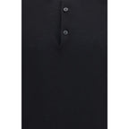 Premiata black cotton polo shirt shown on a hanger, featuring a classic collar and short sleeves, in a casual men's fashion style.