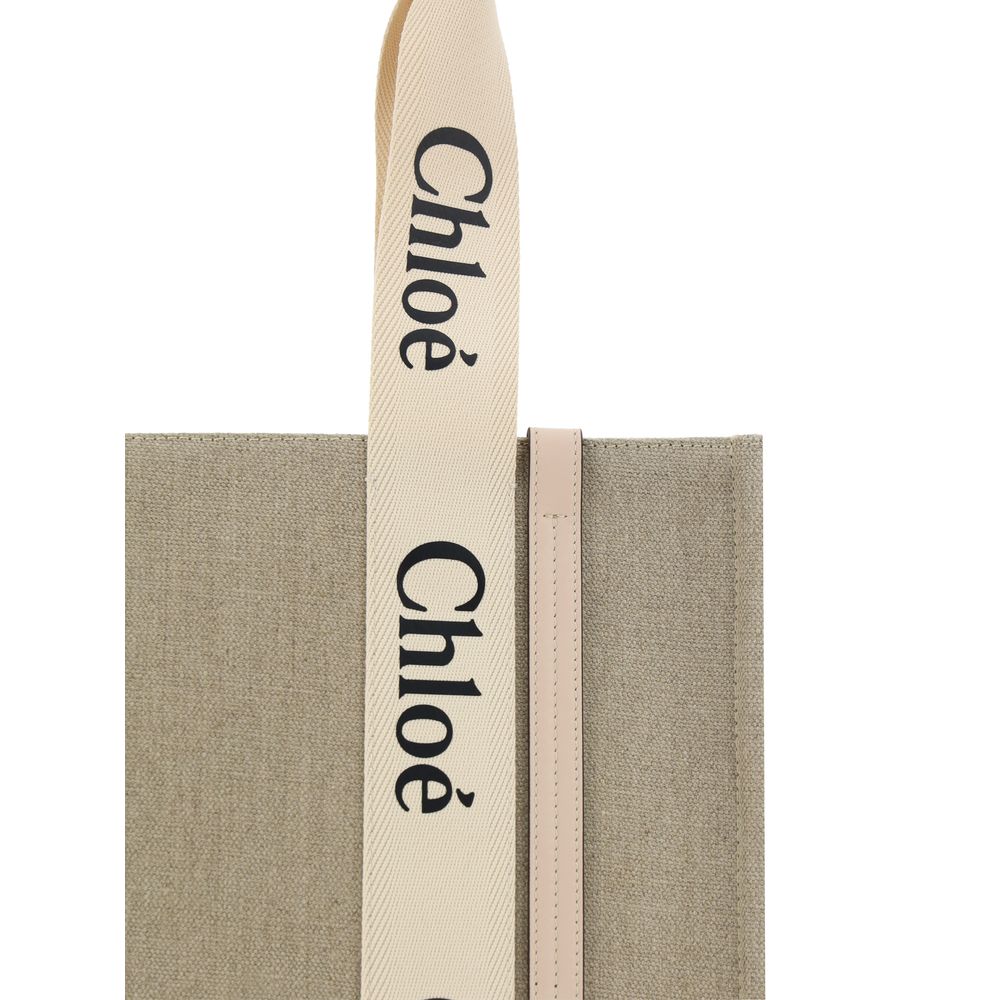 Chloé beige linen handbag with top handles and subtle branding, showcasing a stylish and elegant accessory for everyday use.