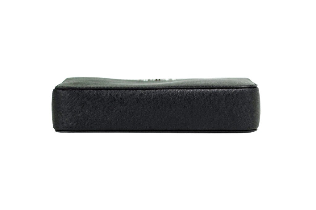 Black Michael Kors East West Crossbody Bag with gold accents, featuring a compact design and adjustable strap.