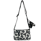Michael Kors floral crossbody tech attachment bag with adjustable strap and spacious interior, designed for stylish convenience.