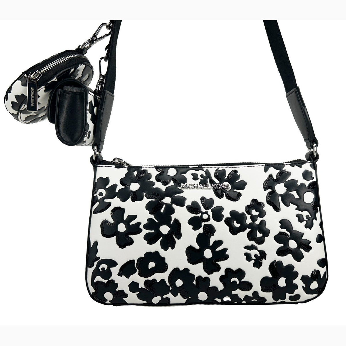 Michael Kors floral crossbody tech attachment bag with colorful floral design and adjustable strap, suitable for carrying small tech essentials.