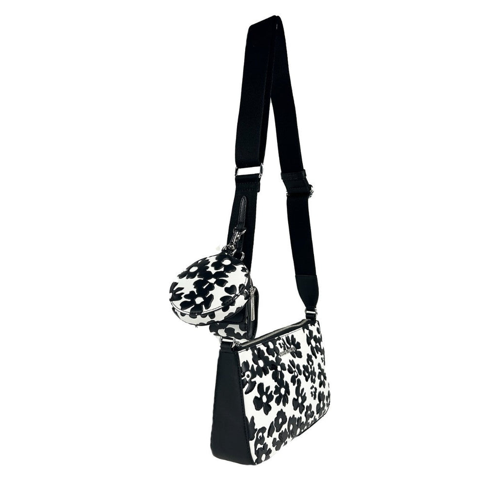 Michael Kors floral crossbody tech attachment bag with colorful design and adjustable strap, perfect for carrying essentials.