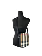 Burberry Paddy Check crossbody bag with beige, black, and red check pattern, featuring leather accents and a compact design.