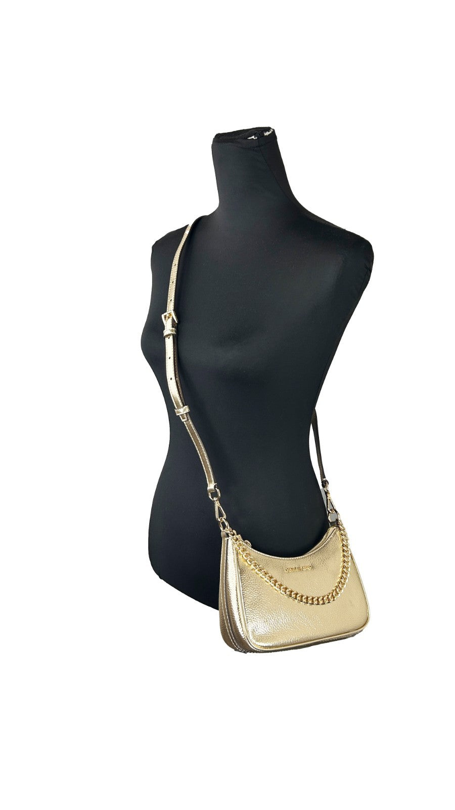 Michael Kors small pouchette crossbody bag in black leather with gold hardware and adjustable strap on a plain background.