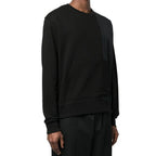 Herno black cotton sweatshirt showing a casual fit with ribbed cuffs and crew neckline, on a plain background.