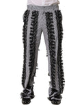 Dolce & Gabbana black and gray pinstripe embellished trouser pants with tailored fit and decorative details.