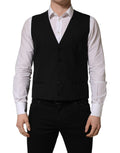 Black wool Dolce & Gabbana single-breasted waistcoat vest with tailored fit and classic lapel, shown on a neutral background.