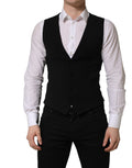 Dolce & Gabbana black wool single-breasted waistcoat vest displayed on a hanger with detailed tailoring and classic design.