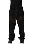 Black lace mid-waist jogger trousers for men by Dolce & Gabbana, featuring stylish lace detailing and a relaxed fit.