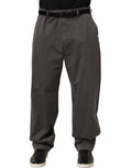 Dark gray Dolce & Gabbana men's mid-waist straight trouser pants displayed on a hanger.