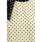 Beige silk blouse by Valentino Garavani featuring a relaxed fit and elegant design, perfect for sophisticated fashion looks.