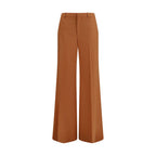Chloé orange cotton flared pants displayed on a model, featuring a high waist and wide-leg design.