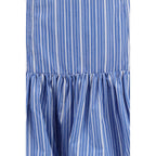 Ganni blue cotton mini skirt with a fitted waistband and casual style, displayed on a hanger.
