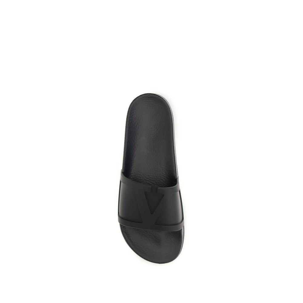 Valentino Garavani black rubber flat sandals with open toe and minimalist design for casual summer wear