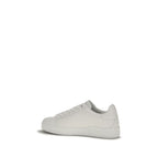 Dolce & Gabbana white calf leather Bos Taurus low top sneakers with textured sole and lace-up design.