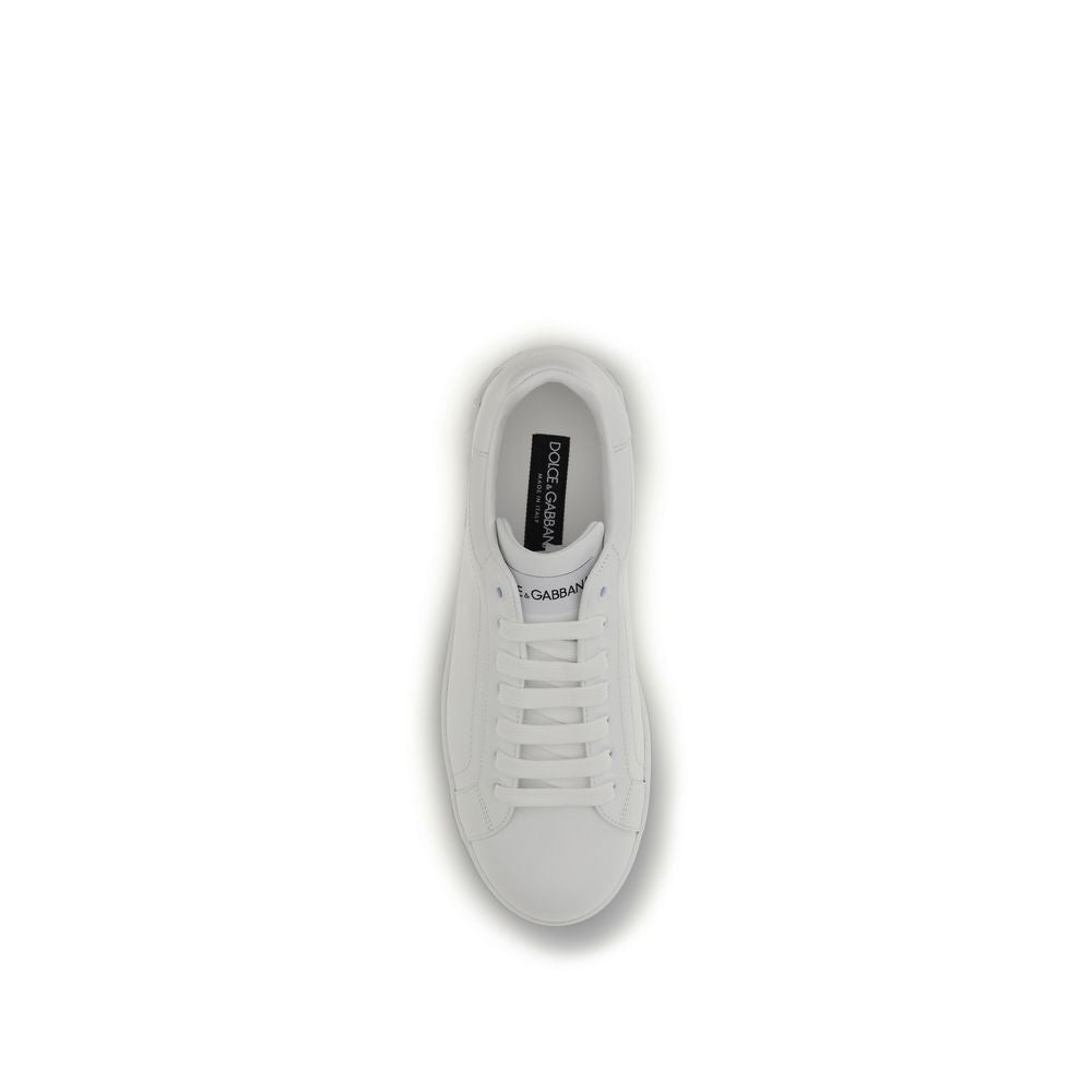 Dolce & Gabbana white calf leather Bos Taurus low top sneakers with lace-up design and sleek, minimalist style.