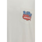 White cotton T-shirt by Represent featuring a classic fit and minimal design, displayed flat on a neutral background.