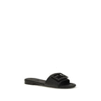 Fendi black calf leather Bos Taurus flat sandals with open toes and ankle straps, stylish and comfortable footwear.