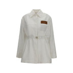Fendi white linen full-length jacket displayed on a hanger, showcasing its tailored design and lightweight fabric.