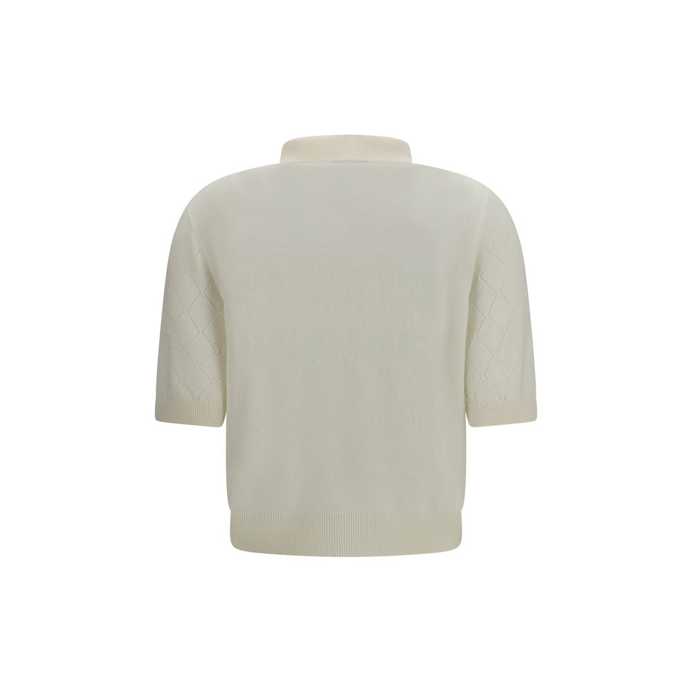 Balmain white wool Oves Aries polo shirt featuring a classic collar and textured knit fabric on a plain background.
