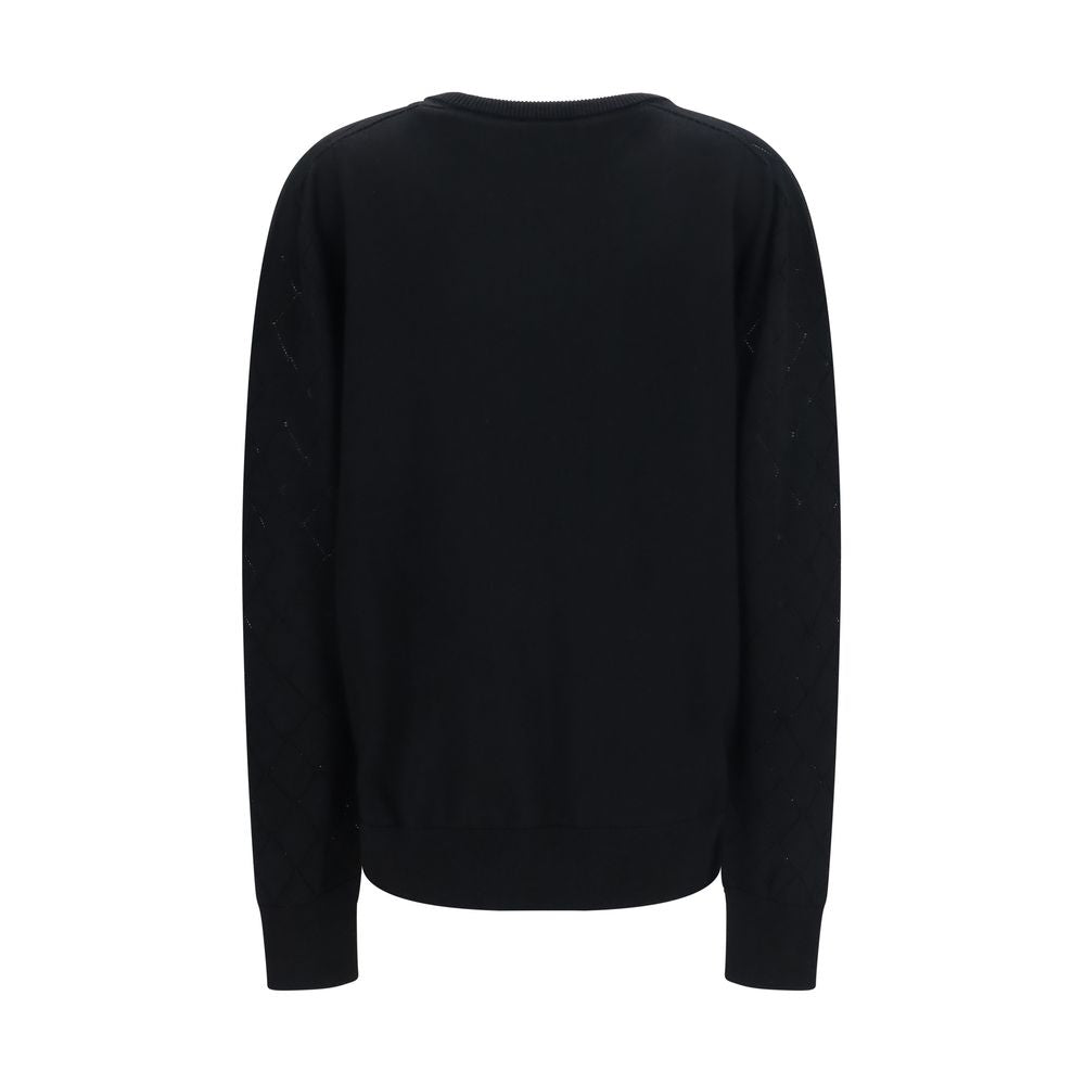Balmain black wool oversize Aries sweatshirt with ribbed cuffs and hem, featuring bold Aries logo on front.