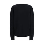 Balmain black wool oversize Aries sweatshirt with ribbed cuffs and hem, featuring bold Aries logo on front.